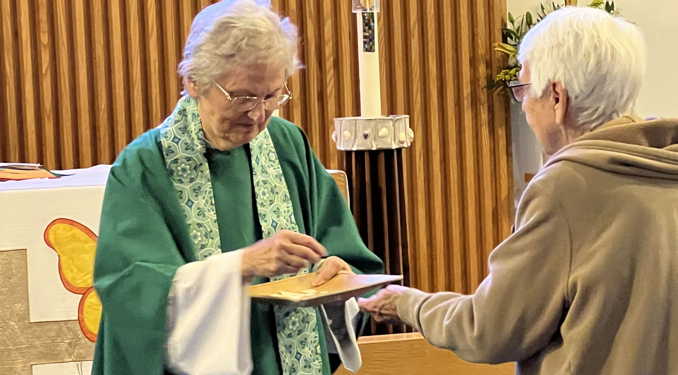 Priest Distributing Communion